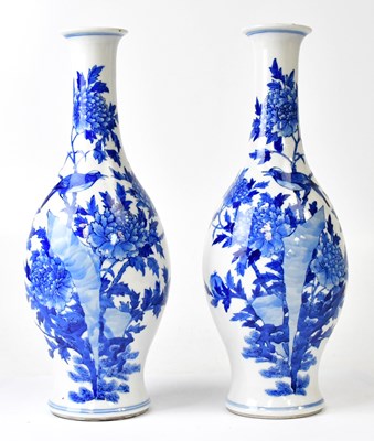 Lot 369 - A pair of 19th century blue and white bottle...