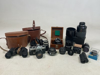 Lot 148 - A quantity of cameras, lenses and binoculars.