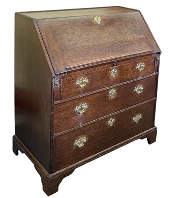 Lot 67 - A 19th century oak bureau, the fall front...