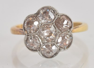 Lot 1229 - An 18ct yellow gold diamond set flowerhead...