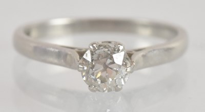 Lot 1242 - A platinum diamond solitaire ring, the central...