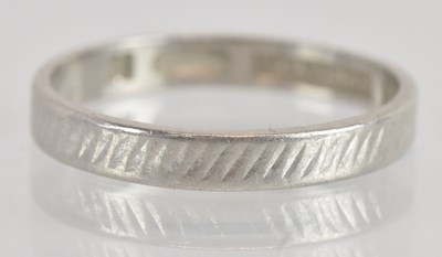 Lot 1264 - A platinum wedding band, size L, approx 2.5g.