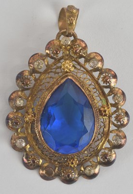 Lot 1437 - A yellow metal teardrop shaped filigree work...