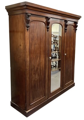 Lot 26 - A Victorian mahogany three door wardrobe, with...