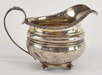 Lot 1075 - A George IV hallmarked silver milk jug, London...