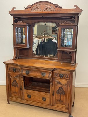 Lot 429 - An Edwardian Art Nouveau walnut mirror back...