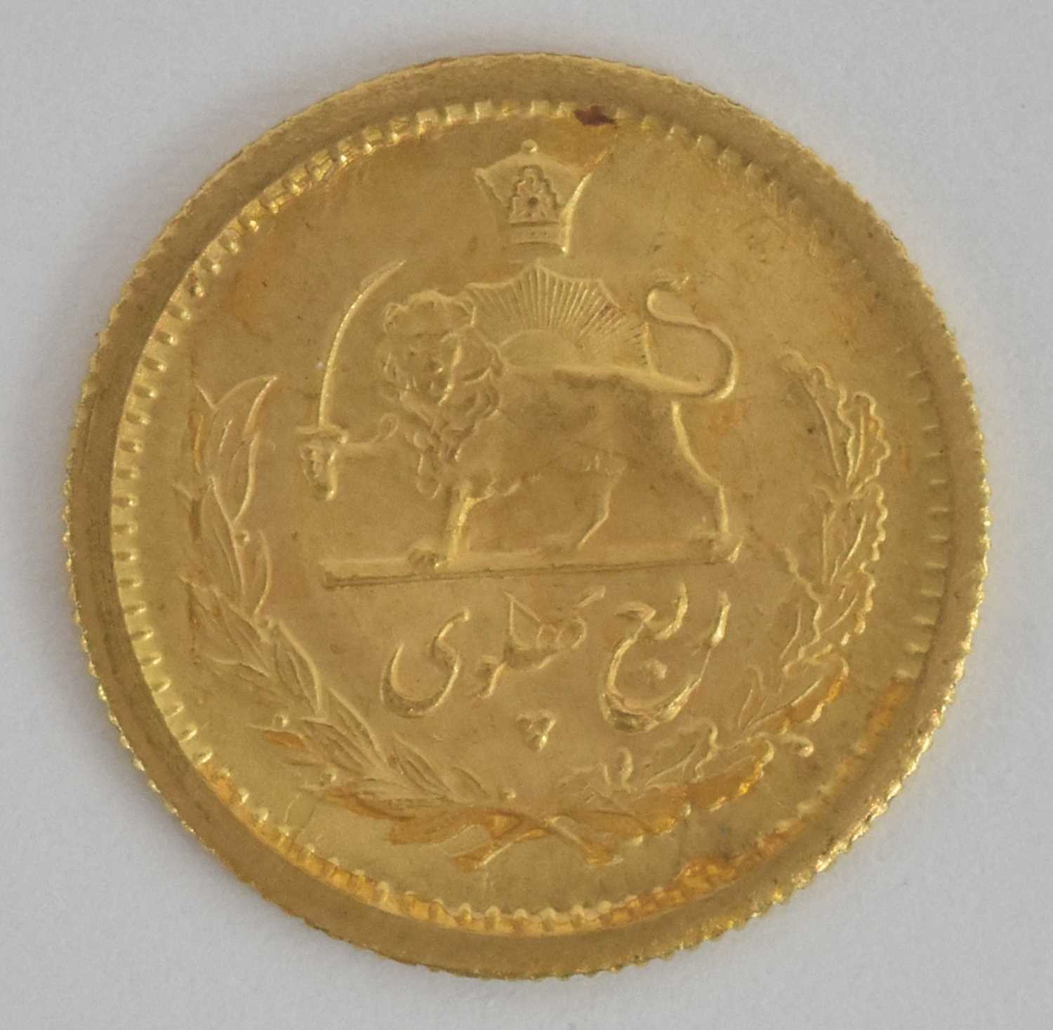 Lot 1635 - A Persian one quarter Pahlavi gold coin, 1917,...