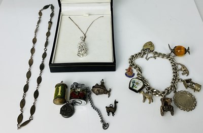 Lot 681 - A silver charm bracelet, a Swarovski necklace,...