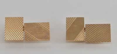 Lot 1462 - A pair of 9ct gold rectangular cufflinks with...