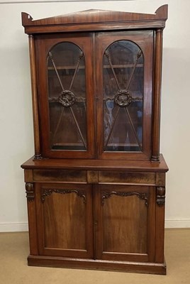Lot 690 - A Victorian mahogany bookcase on cupboard,...