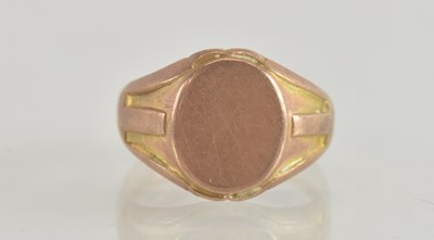 Lot 1302 - A 9ct rose gold signet ring with blank oval...