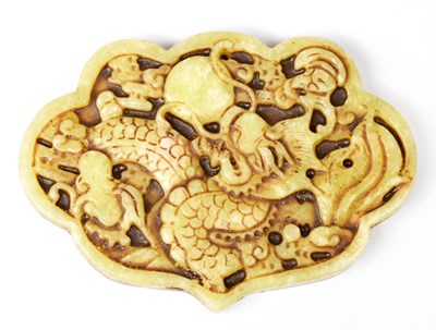 Lot 377 - Two carved jade pendants, one decorated with a...