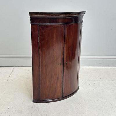 Lot 1189 - A 19th century mahogany bowfronted corner...