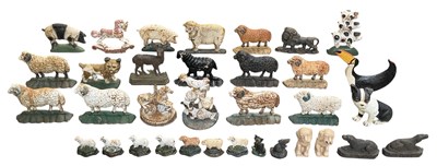 Lot 109 - A collection of thirty-four assorted cast iron...