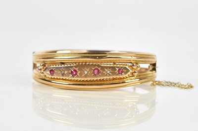 Lot 28 - A Victorian yellow metal diamond and red stone...