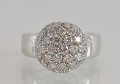 Lot 1224 - An 18ct white gold diamond cluster ring, with...
