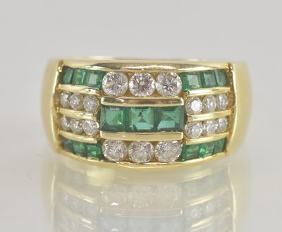 Lot 1230 - An 18ct gold contemporary diamond and emerald...