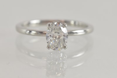 Lot 1215 - A platinum diamond solitaire ring, the claw...