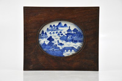 Lot 1552 - A Chinese porcelain blue and white oval panel,...