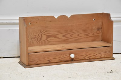 Lot 1038 - An old pine wall hanging shelf with single...