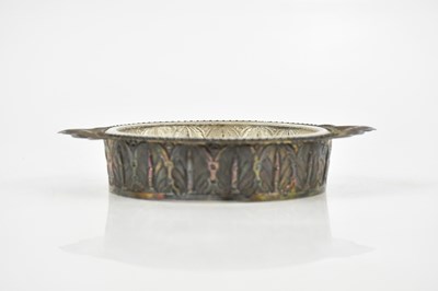 Lot 2132 - An Indian white metal twin handled butter dish...