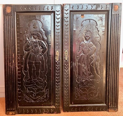 Lot 1184 - A pair of dark oak furniture doors in the...