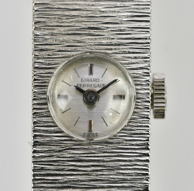 Lot 574 - GIRARD-PERREGAUX; a lady's textured white...
