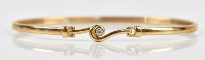 Lot 40 - A 9ct yellow gold diamond set bangle, length...