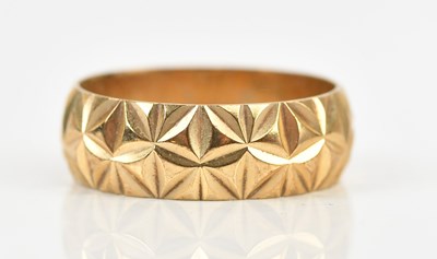 Lot 484 - A 9ct yellow gold textured wedding band, size...