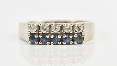 Lot 435 - A white metal diamond and sapphire set ten...