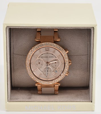 Lot 1748 - MICHAEL KORS; a modern lady's rose coloured...