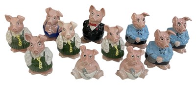 Lot 557 - WADE; a collection of eleven NatWest piggy...