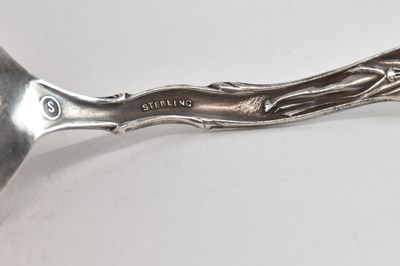 Lot 1173 - Four sterling silver souvenir spoons, one for...