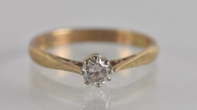 Lot 1306 - A 9ct gold diamond set solitaire, size K,...