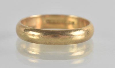 Lot 1353 - A 9ct gold band ring, size L, approx 2.2g.