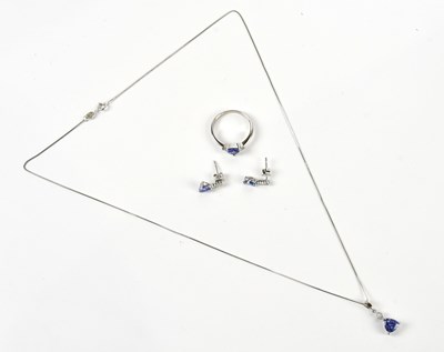 Lot 372 - A white metal diamond and tanzanite pendant...
