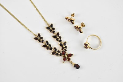 Lot 231 - A yellow metal and garnet set suite, stamped...