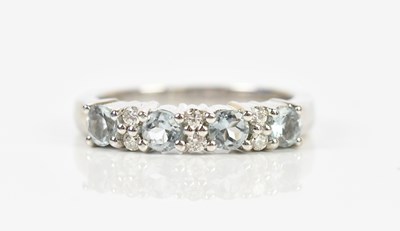 Lot 491 - An 18ct white gold diamond and aquamarine ten...