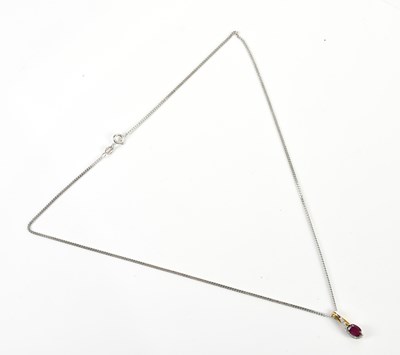 Lot 311 - A yellow and white metal diamond and synthetic...