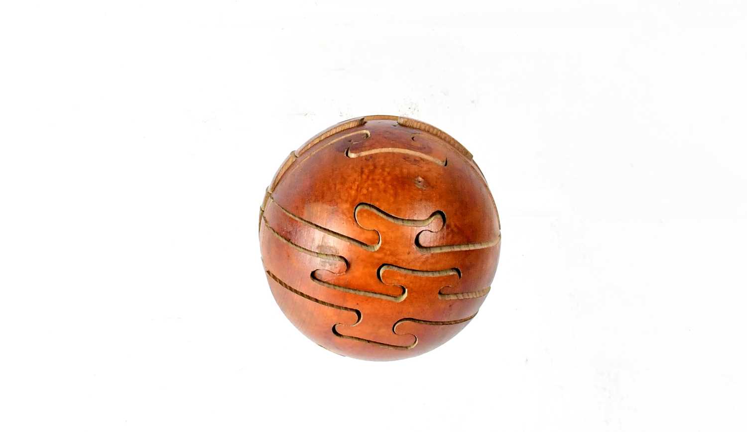 Lot 215 - A wooden puzzle ball.