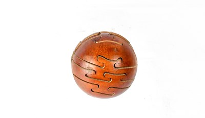 Lot 215 - A wooden puzzle ball.