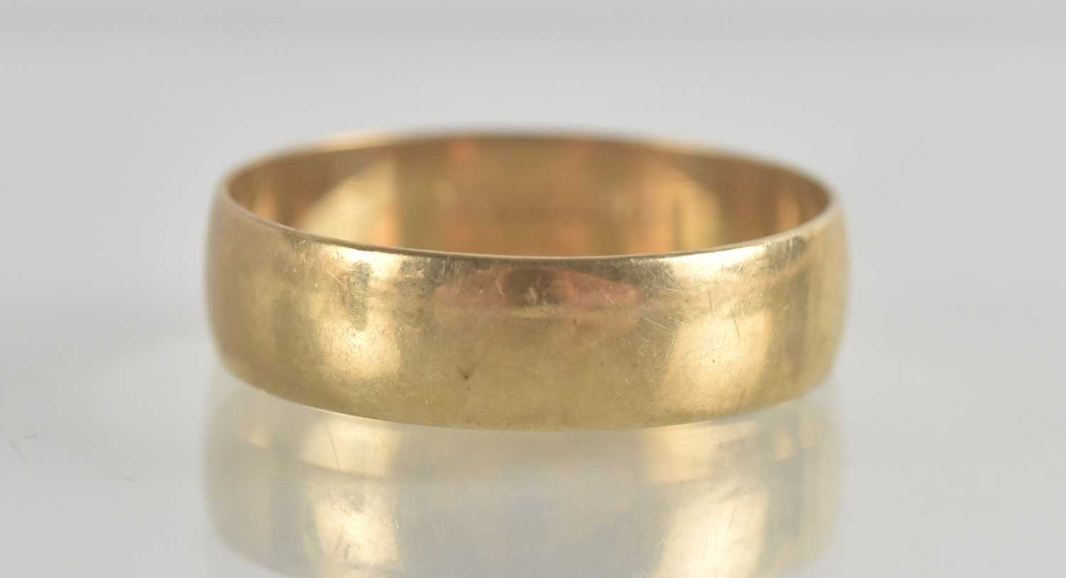 Lot 1352 - A 9ct gold wide band ring, size X, approx 3g.