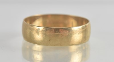 Lot 1352 - A 9ct gold wide band ring, size X, approx 3g.