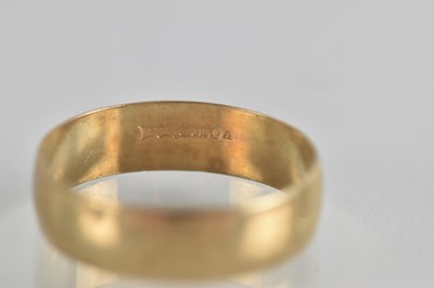 Lot 1352 - A 9ct gold wide band ring, size X, approx 3g.