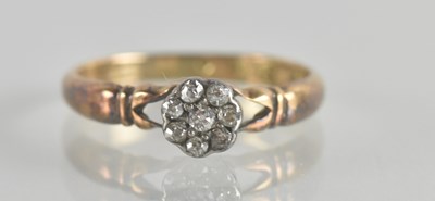 Lot 1311 - An 18ct gold diamond cluster ring, the cluster...
