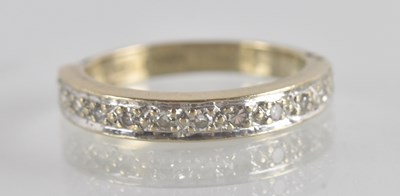 Lot 1297 - An 18ct white gold half eternity ring set with...