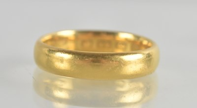 Lot 1248 - A 22ct gold band ring, size O, approx 5.6g.