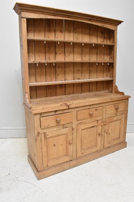Lot 1023 - A Victorian pine dresser with three drawers...