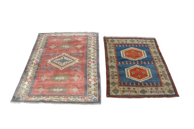 Lot 1253 - An eastern red ground handknotted carpet with...