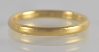Lot 1270 - A 22ct gold band ring, size O, approx 3g.